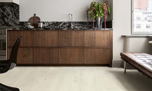 brown kitchen with a grey laminate floor